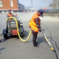 Machine de cachetage de réparation de route d'asphalte montée par remorque 100L